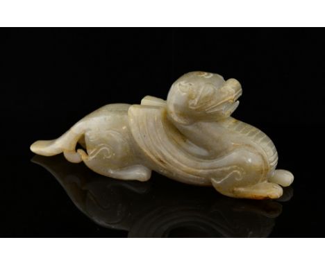 Chinese grey and brown streaked jade carving of a recumbent mythical beast, 16.5cm long, .  