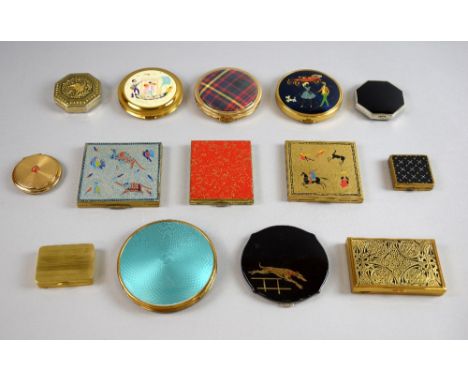 A collection of 1950's and later powder compacts in various shapes and finishes including Toledo Damascene, lacquer, enamel, 
