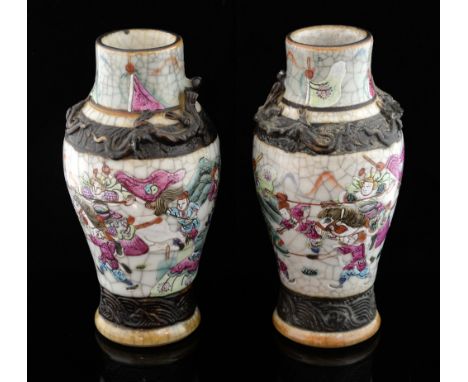 Pair of Chinese famille rose baluster vases decorated with figures and two bands of iron oxide, incised mark to base, 18.5cm 