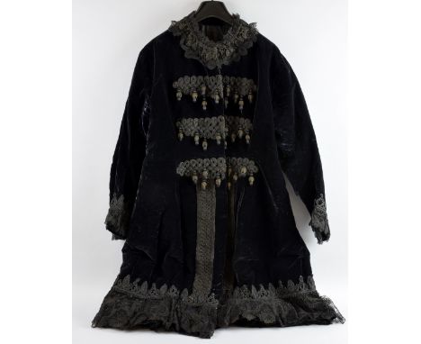 Edwardian black silk velvet long jacket with highly decorative frogging to front and lace and cord work trim on neck, cuffs a