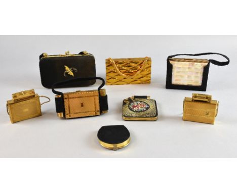 A collection of carryalls and keepalls in gilt metal, silk, mother of pearl and tapestry finishes, including examples signed 