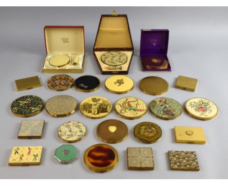 Vogue compacts in decorative patterns including exotic flowers, birds and animals in a variety of gilt , enamel and lacquer f