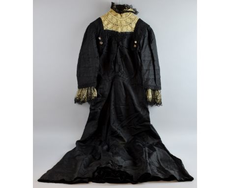 An Edwardian silk and lace mourning dress with lace trim sleeves, cut steel  and mother of pearl buttons,  another with fancy