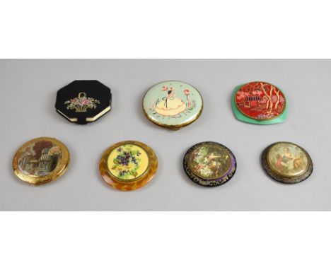 Seven 1920's-1930's compacts, with prints, enamel or embroidered decoration  .  Overall good condition. Please see additional