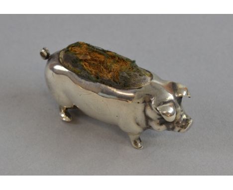 An Edward VII silver pig pin cushion, Birmingham, 1905, maker possibly Levi & Salaman, 2 in. (5 cm.) long.  Maker's mark rubb