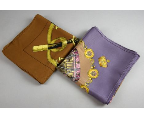 Hermes silk scarves in the Tambours (drums) and Eperon d'Or (bridle and sword) patterns, approximately 90 cm square.  Both sc