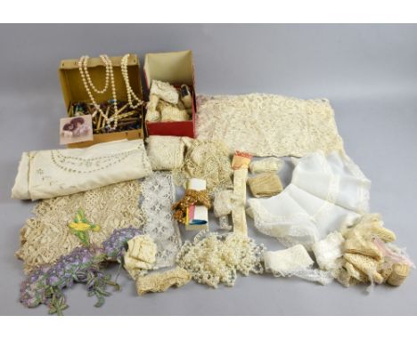  A 19th century lace makers cushion and bowed pillow horse with bobbins and  lace, a large quantity of lace making materials,
