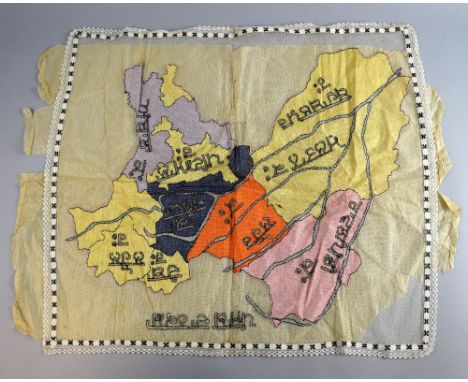 Embroidered map of the Punjab, with regions named in Hindi, first quarter 20th C,other items to include 3 pairs of shoes, pin