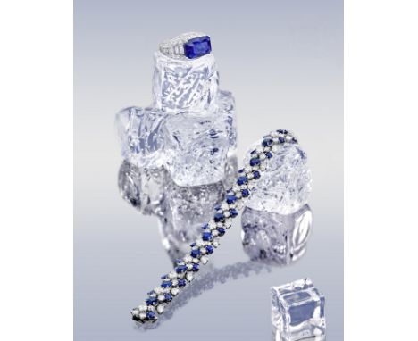 A fine sapphire and diamond 'Trombino' ring, Bulgariof raised dome design, horizontally-set with a rectangular-shaped step-cu