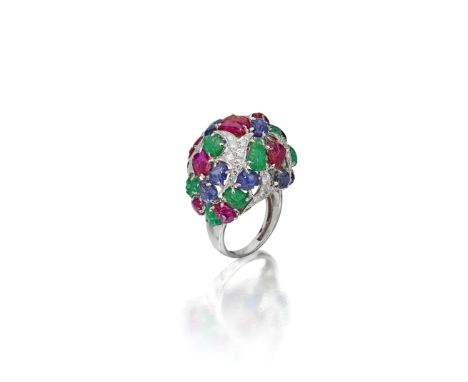 A diamond and gem-set ringof openwork bombé form, decorated with carved cabochon ruby, sapphire and emerald leaves to branche