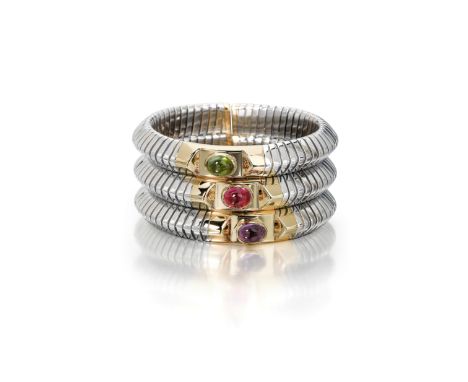 An 18k gold, steel, and gem-set bangle bracelet, Bulgari, Italyof stacked design, the steel tubogas pipes with gold inlay set