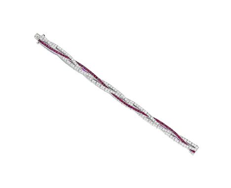 A ruby and diamond braceletdesigned as three intertwined rows of round brilliant and single-cut diamonds and calibré-cut rubi