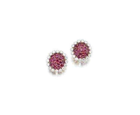 A pair of ruby and diamond earclipsof cluster design, set with circular-shaped rubies and round brilliant-cut diamonds; with 
