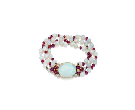 An opal, ruby, and diamond bracelet,  Seaman Scheppscomposed of three strands of round opal beads, measuring approximately fr