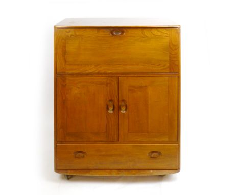 An Ercol elm bureau, the fall front over two doors and a drawer, on castors, w. 83 cm CONDITION REPORT: Generally good, no ma