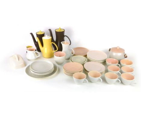 A Poole coffee pot in brown and yellow, a matching teapot and jug, together with a large selection of Poole tablewares in var