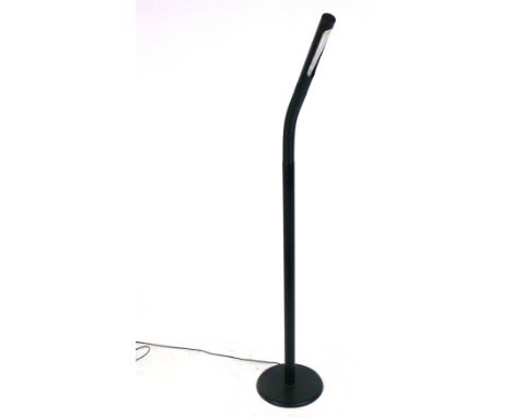 A 1980's single spot standard lamp in black with an adjustable shade  CONDITION REPORT: Dents, knocks, pitting, working order