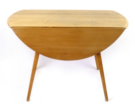An Ercol elm drop-leaf dining table on beech square tapering legs, d. 104 cm CONDITION REPORT: Structurally sound but with he