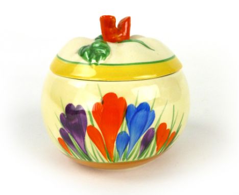 Clarice Cliff for Newport Pottery, a 'Crocus' pattern sugar bowl with cover, d. 9 cm CONDITION REPORT: Chip to cover, crackle