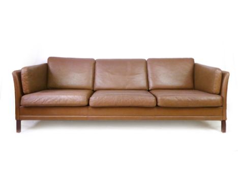 A 1970's brown leather three-seater sofa on mahogany square legs, in the manner of Borge Mogensen, l. 216 cm CONDITION REPORT