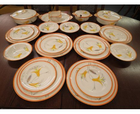 An early 20th century Gray's pottery part dinner service, floral decoration in oranges, yellows and grays, pattern number A18