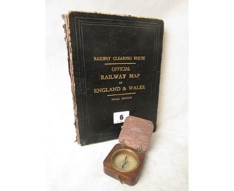 A 19th century wooden cased pocket compass, the lid stamped Doughty 3/West Stand, with paper dial, along with a folding Offic