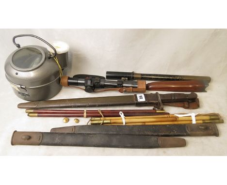 A First World War American Remington model bayonet dated 1917, in a leather scabbard, a telescope sighting No.220 Mk 1, anoth