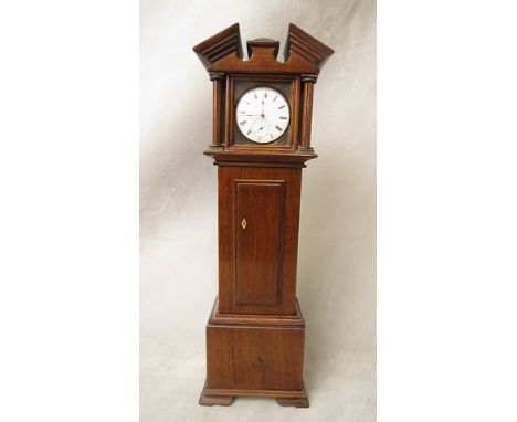 An Edwardian watch holder in the form of a longcase clock, mahogany cased with ivory coloured escutcheon and gilt brass capit