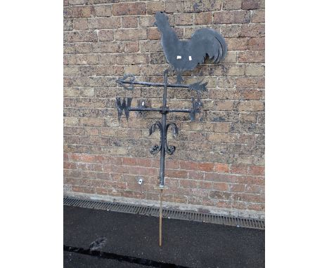 A WROUGHT STEEL WEATHERCOCK the cockerel of sheet metal, on an arrow,on fitting 106 cm high, plus lower spike