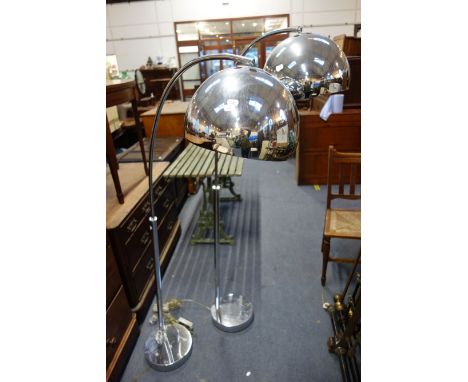 A PAIR OF POST MODERNIST FLOOR LAMPS bases dented, misshapen with wear and with loose columns