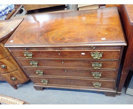 A GEORGE III MAHOGANY BATCHELOR'S CHEST OF DRAWERS fitted a brushing slide on bracket feet, 77cm high x 94cm wide