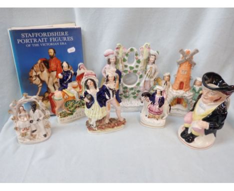 A COLLECTION OF STAFFORDSHIRE FLAT BACK FIGURES 19th century, a Toby Jug (cracked) and a book on Staffordshire portrait figur