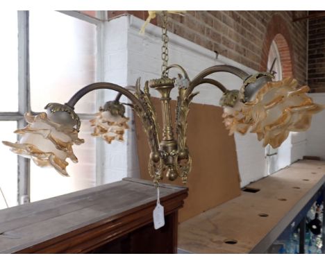 A FRENCH BRASS FOUR BRANCH CHANDELIER with frosted glass shades