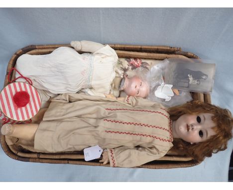 AN ARMAND MARSEILLES BISQUE HEADED DOLL (eyes detached, comp. fingers broken) 62 cm , another with broken head, and a vintage