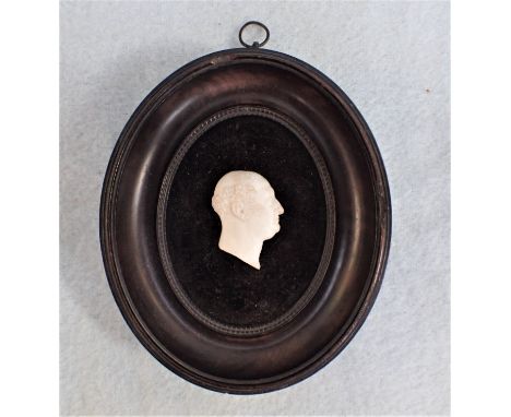 A GRAND TOUR STYLE PORTRAIT PLAQUE in a 19th century frame