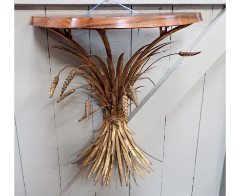 A GILT METAL CONSOLE TABLE formed as a wheatsheaf, wall mounted, with demi-lune top 62 cm wide (some ears of wheat missing)
