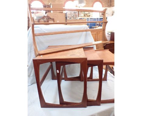 A 'G-PLAN NEST OF THREE TABLES and an Ercol plate rack (both with water damaged finish)