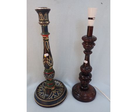 A CARVED TABLE LAMP and a large turned candlestick or lamp base with 'barge' type painting