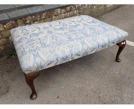 AN UPHOLSTERED CENTRE STOOL with cabriole legs