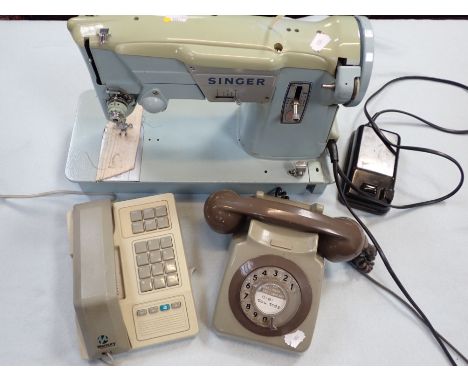A VINTAGE SINGER 357 ELECTRIC SEWING MACHINE and two retro telephones