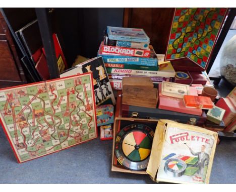 A VINTAGE TOY ROULETTE WHEEL and a quantity of games and other items (most quite worn)