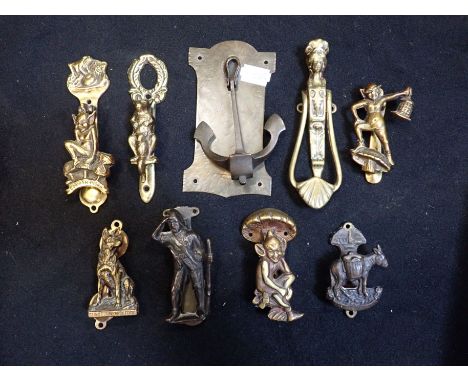 AN ARTS AND CRAFTS STYLE DOOR KNOCKER in the form of an anchor and a collection of novelty knockers