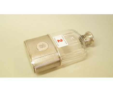 A Victorian silver mounted glass hip flask, by Wright & Davies, London 1877, having engine turned decoration and engraved mon