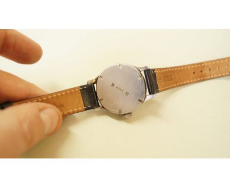 A WWII Longines DH (Deutsches Heer) German Army wristwatch, having 3cm dial decorated Arabic numerals and subsidiary seconds 