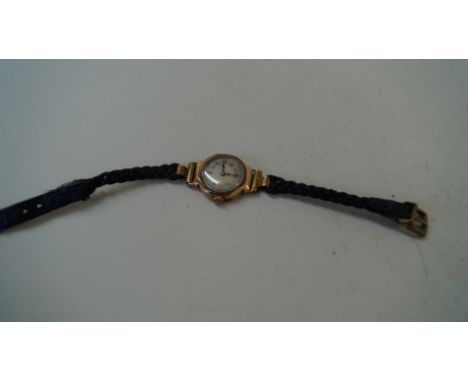 A vintage 9ct gold mechanical ladies wristwatch, having cord strap.