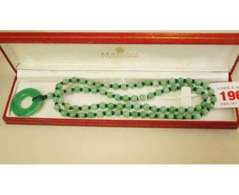 A boxed Chinese jade bead necklace, 62cm.