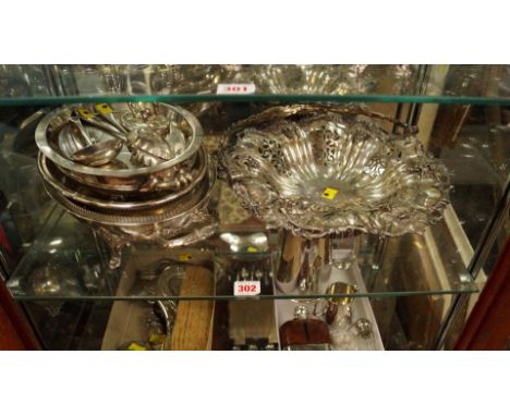 A silver plated swing handle fruit bowl; together with two entree dishes; a pair of berry spoons and a sauce ladle.