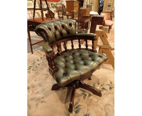 Green Chesterfield style captains chair with button back and seat