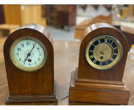 Two early 20th century mahogany arched top single train mantle clocks with ceramic and Roman faces. 28cm high approx. (2) (B.