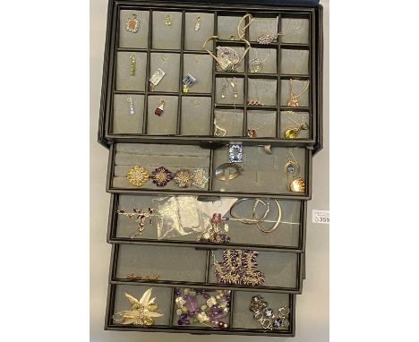 Jewellery box in the form of a briefcase comprising, assorted mainly silver jewellery: rings, necklaces, pendants, some gold 